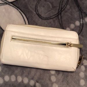 White clutch with gold zipper